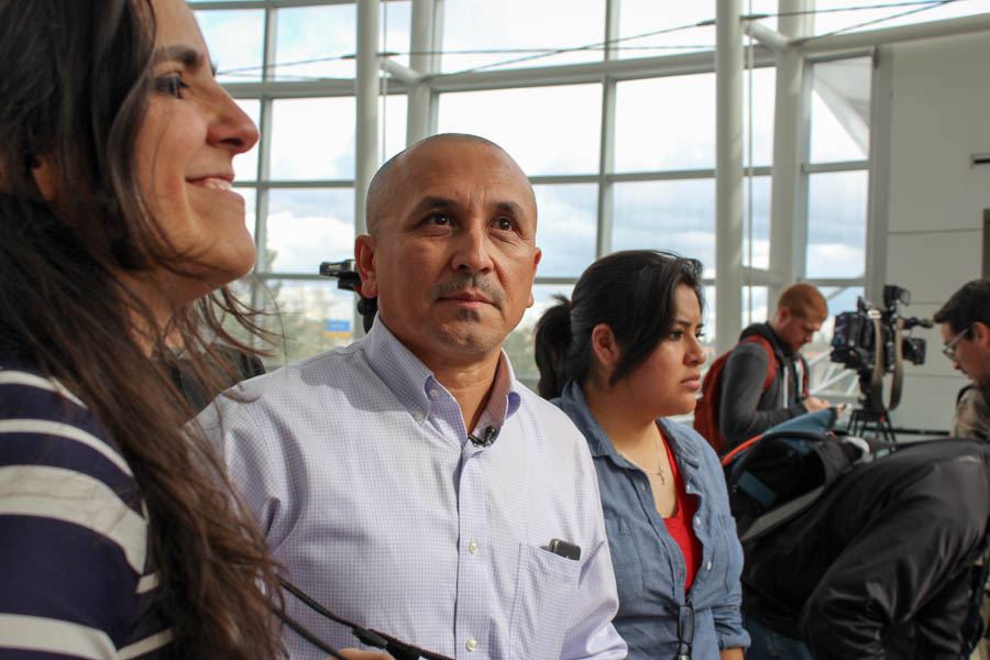 Jose Luis Avila (center) looks pensive as he awaits the return of his wife, Nestora Salgado, who spent 31 months in jail in Mexico. To his right is human rights attorney Alejandra Gonza. (Photo by Venice Buhain.)