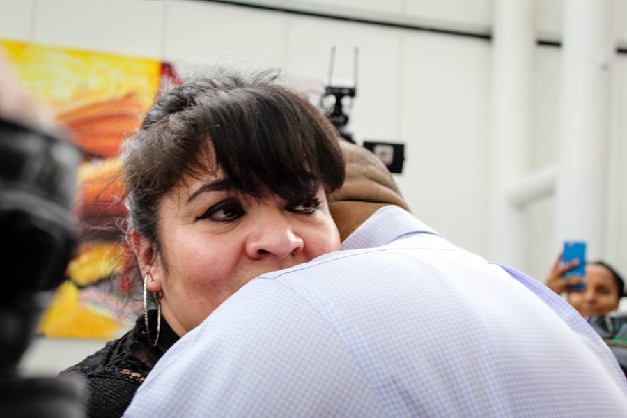 Community police leader Nestora Salgado embraces her husband Jose Luis Avila — the first time they've seen each other in person since she was jailed in Mexico more than two years ago on kidnapping charges that were dismissed this month. (Photo by Venice Buhain.)