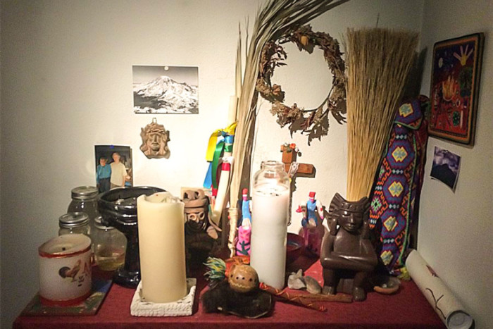 A picture of Peter Brown and his Huichol teacher is pinned to the wall of his practice next to a collection of items gathered during his pilgrimages to Mexico. (Photo by Cristina Acuña)