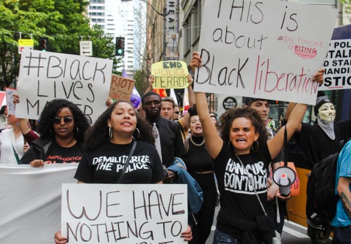 Black Lives Matter protesters side by side with anarchists during the 2015 May Day protests. (Photo from Flickr by <a href="https://www.flickr.com/photos/scottlum/">scottlum</a>)