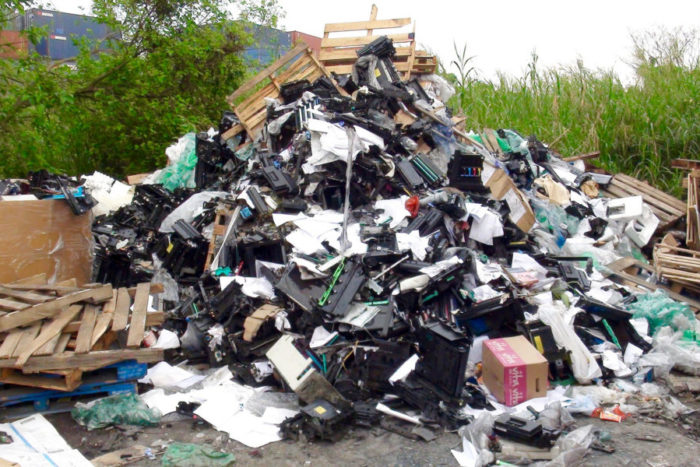 Pile of printer scrap outside on ground near New Territories junkyard in New Territories Hong Kong in March. (Photo by Basel Action Network via Flickr.)