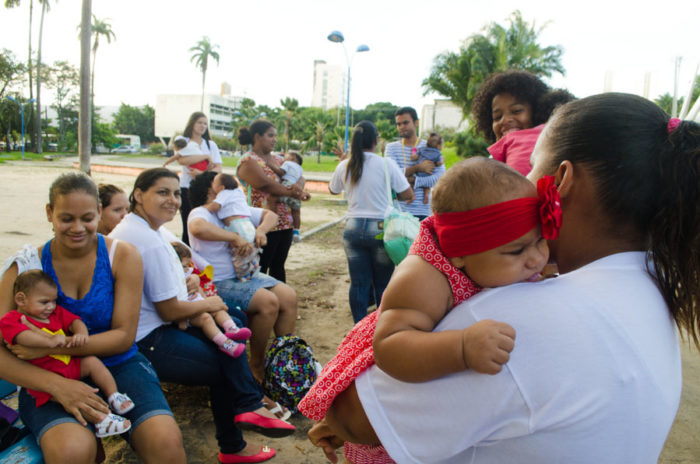 Members of the "Union of Mothers of Angels" group, whose babies all have microencephaly, gather at a park in Pernambuco to prepare for a street protest. (Photo by Katherine Jinyi Li)