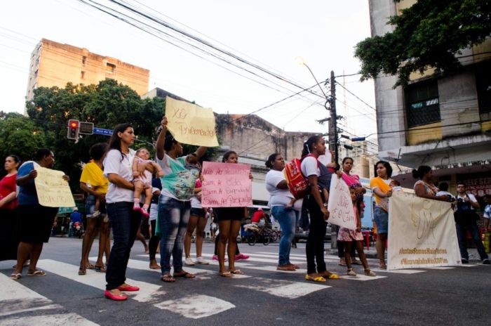 UMA mothers block traffic in Recife chanting "Respect!" and holding signs that read "Boo, prejudice." (Photo by Katherine Jinyi Li)