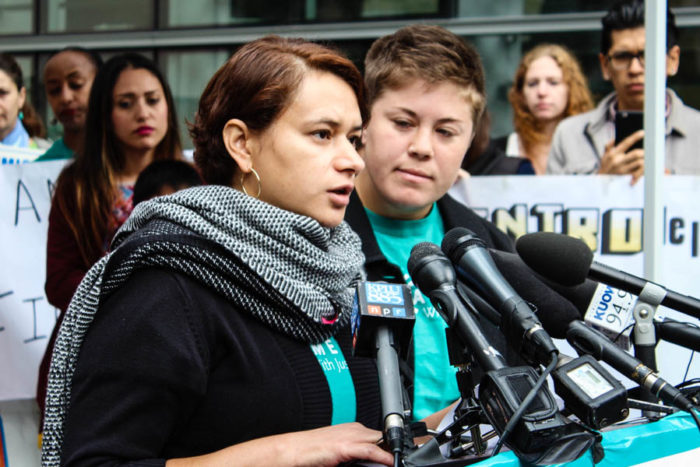 Ela Tinoco speaks at a press conference in Seattle. Tinoco would have qualified for the DAPA program. (Photo by Venice Buhain.)
