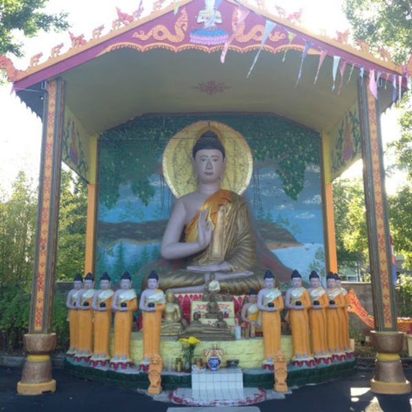 Lord Buddha statue at Wat Lao Dhammacetiyaram Photography by Naduni Perera