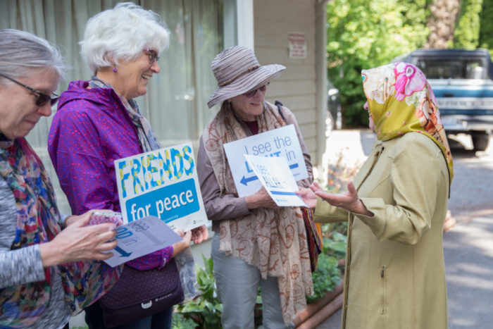 Handan Shami (on the right) thanks Seattle-area Quakers and others at the Islamic Center of Federal Way. (Photo by Alex Garland)