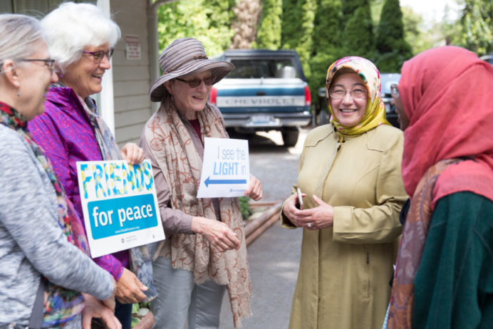 Handan Shami (second from right) thanks Seattle-area Quakers and others at the Islamic Center of Federal Way. (Photo by Alex Garland)
