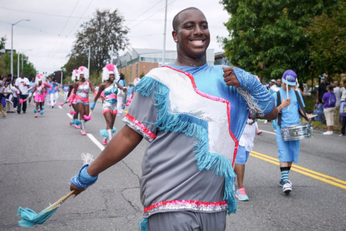 Preston McInnis marches with the Electronettes in the Umoja Festival Parade.