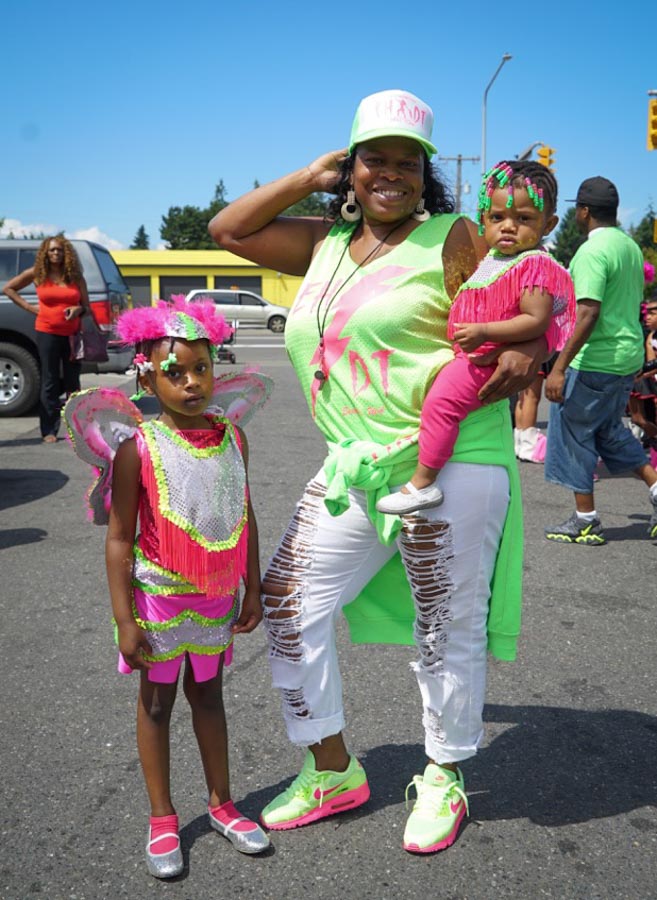 As a girl Vitina Patterson was a drill team captain, winning competitions in the Washington, Canada, Oklahoma, Arizona and Las Vegas. Now she's executive director of the Electronettes. Here she is holding her granddaughter Vitina Winston, with her great niece Shawniyah Turner ready to perform.