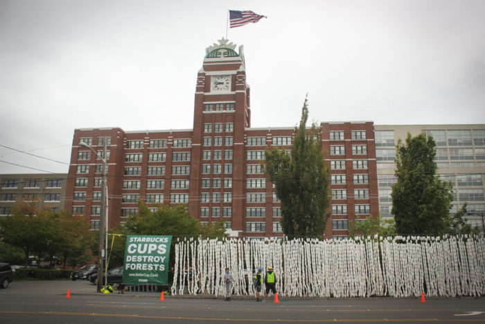 An eight foot high wall of disposable Starbucks cups lined the street in front of the company's SoDo headquarters on Wednesday morning. (Photo by Esmy Jimenez)