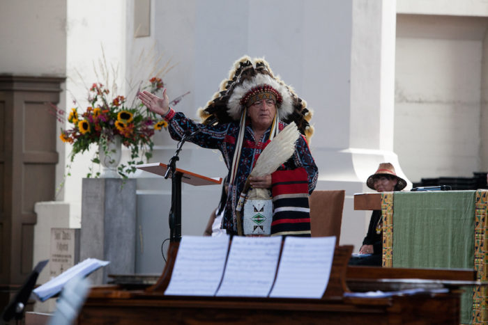 Chief Phil Lane, Jr. addresses the audience during the 2016 Lummi Nation House of Tears Totem Pole Journey celebration on August 25, 2016 at Seattleís Saint Markís Episcopal Cathedral. The Lummi Nation uses their annual totem pole journey to raise awareness of the fossil fuel industryís negative environmental effects.