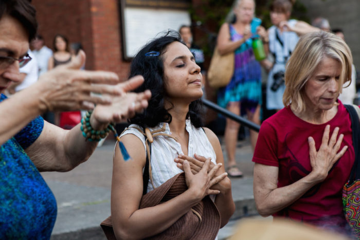 Afrin Sopariwala, of Women of Color Speak Out, participates in a smudging ceremony at the 2016 Lummi Nation House of Tears Totem Pole Journey celebration on August 25, 2016 at Seattleís Saint Markís Episcopal Cathedral.