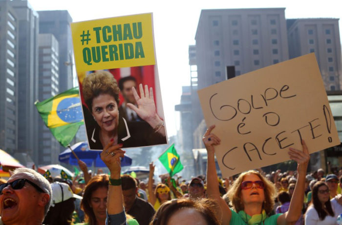 Protesters demand the ouster of suspended President Dilma Rousseff in Sao Paulo on July 31. On the same day, there were protests in Rio against her replacement, Michel Temer. (Photo from Reuters / Rodrigo Paiva)