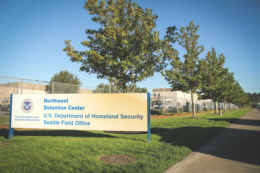Outside the Northwest Detention Center in Tacoma, where immigrants facing deportation are incarcerated, and immigration cases are heard by the Justice Department's Executive Office of Immigration Review. (Photo by Damme Getachew)
