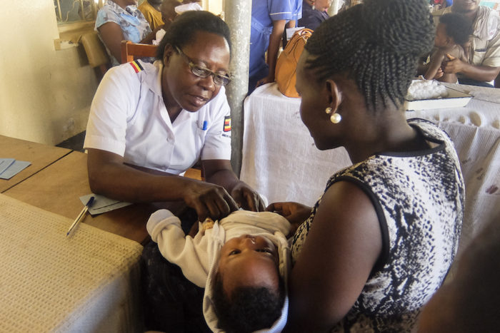 A medical staff member gives a vaccination at Mulago National Referral Hospital in Kampala, Uganda’s capital city. (Edna Namara, GPJ Uganda)
