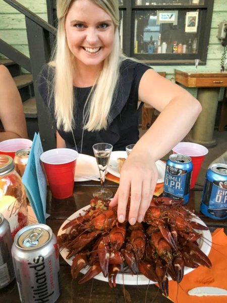 Denice Sigvardsson gets ready for the first crawfish of the year. Cracking them may look easy, but it takes some skill and muscle. (Photo by Yvonne Rogell)