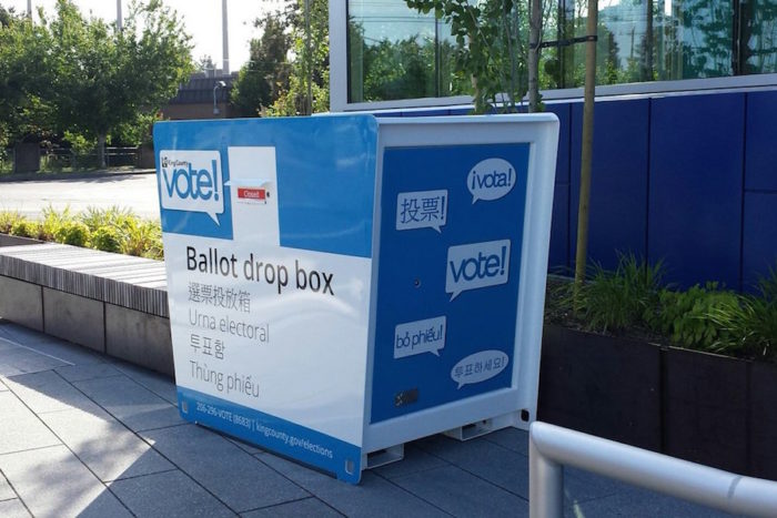 One of the county's relatively new election boxes in Skyway. The box says "vote" and "ballot drop box" in Spanish, Chinese, English, Vietnamese and Korean — the languages that are available on county ballots. (Photo via King County Elections Twitter.)