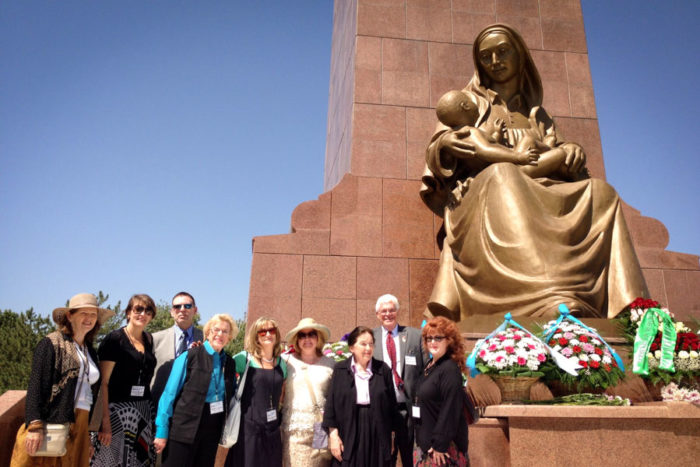 The 2013 Seattle Sister Cities Delegation, under the "Happy Mother" statue in Tashkent. (Courtesy photo)