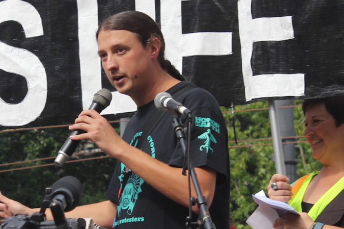 Matt Remle, who is Lakota, addresses the crowd. (Photo by Melissa Lin.)