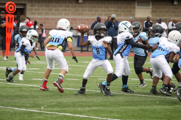 Johnny Rogers, quarterback for the CD Panthers 89er’s, prepares to throw a pass against the SeaTac Sharks