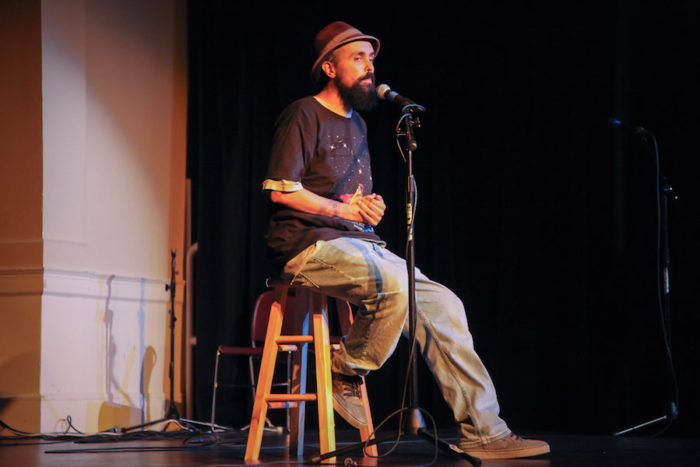 Gabriel Teodros performs at the Seattle Globalist's "Stories of Finding Home" event at the Rainier Arts Center. (Photo by Alex Stonehill)