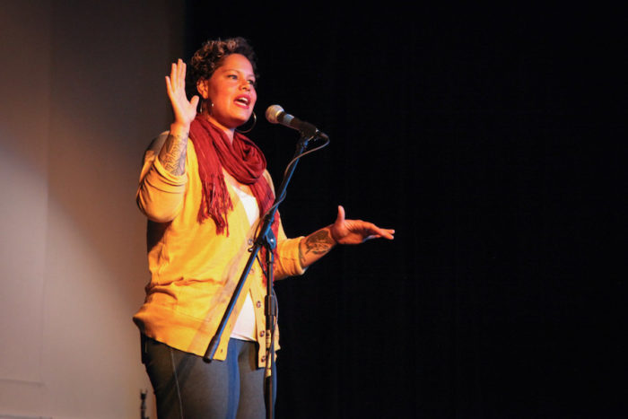 Artist Nikkita Oliver onstage at "Stories of Finding Home," a Seattle Globalist event at the Rainier Arts Center. (Photo by Alex Stonehill)