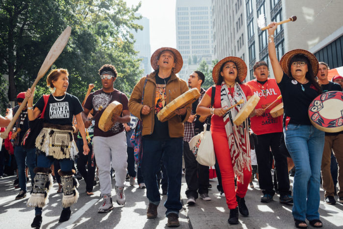 The march in support of the Standing Rock Sioux and against the Dakota Access Pipeline started at Seattle City Hall and ended at Westlake Park. (Photo by Chloe Collyer)