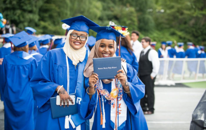 The author, right, and her friend Ifrah Abshir, at graduation from Rainier Beach High School last spring. (Courtesy photo)