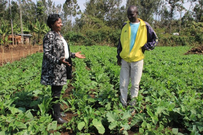 Rosemary Muthomi visits a farmer. (Photo courtesy Meru Greens.)