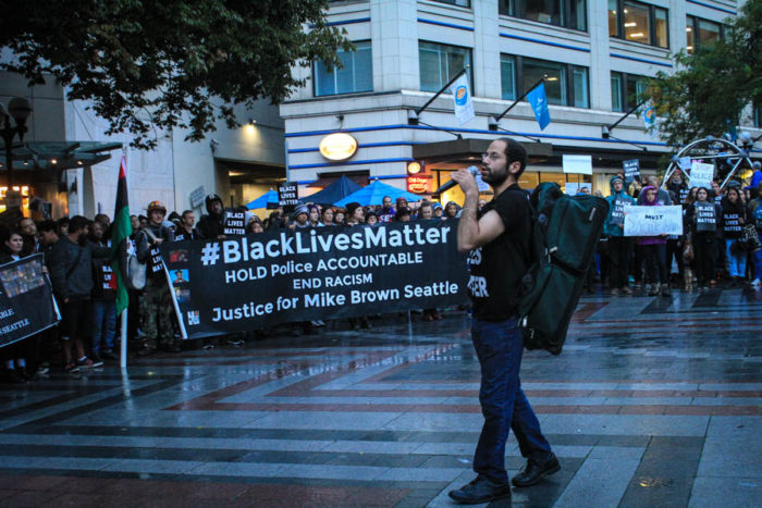 Activist Miles Partman speaks to the crowd at Westlake Park on Saturday Oct. 1. (Photo by Melissa Lin.)