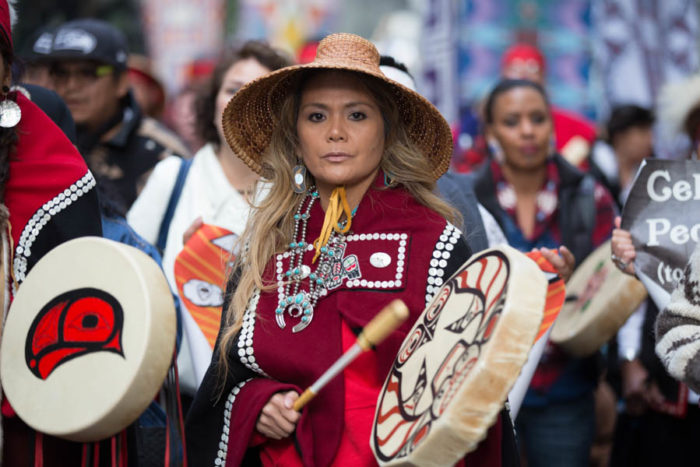 Pamela Kaajeesta Dalton marches in Seattle to celebrate the city's third Indegenous People's Day. (Photo by Alex Garland)
