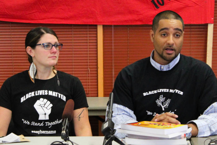 (Left to right) Seattle Public Schools teachers Sarah Arvey and Jesse Hagopian at an announcement that teachers and other staff districtwide plan to wear Black Lives Matter shirts, similar to the ones that they are wearing, as a show of support for students of color. (Photo by Venice Buhain)