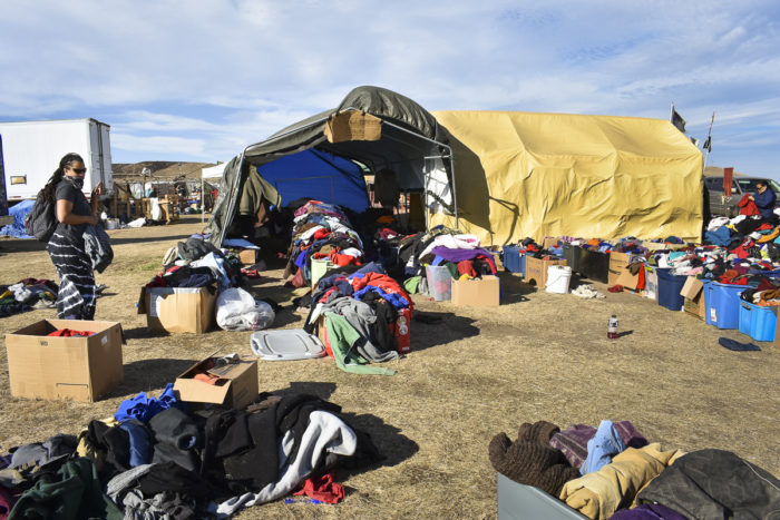 People exiting Sacred Stone Camp often leave their winter coats, shoes and other items behind for people who plan to remain there. (Photo by Natalia Aldana for GPJ Americas)