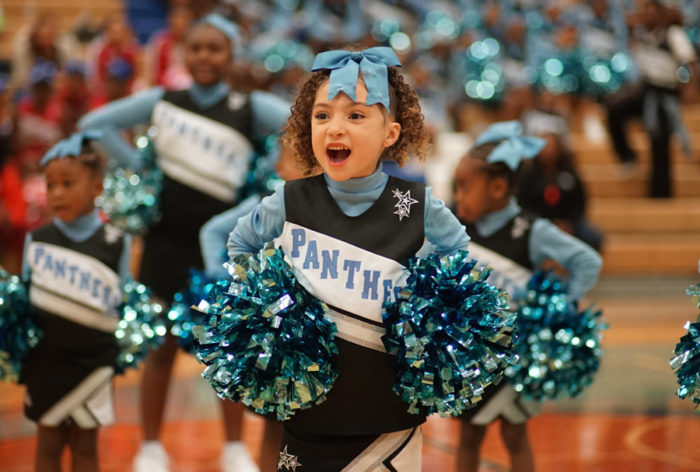 A Mini Central District Panther Cheerleader shows some spirit during the Cheer Competition. (Photo by Susan Fried)