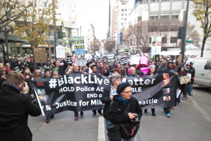 Marchers gathered in downtown Seattle for the third annual Black Friday demonstration. (Photo by Cliff Cawthon.)