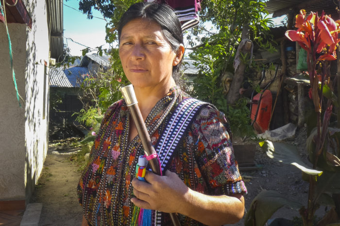 Micaela Soch, seen here holding her community mayor stick, says she hopes more women, especially those who have university degrees, will participate in local politics in the future. (Photo by Norma Baján Balán, GPJ Guatemala)