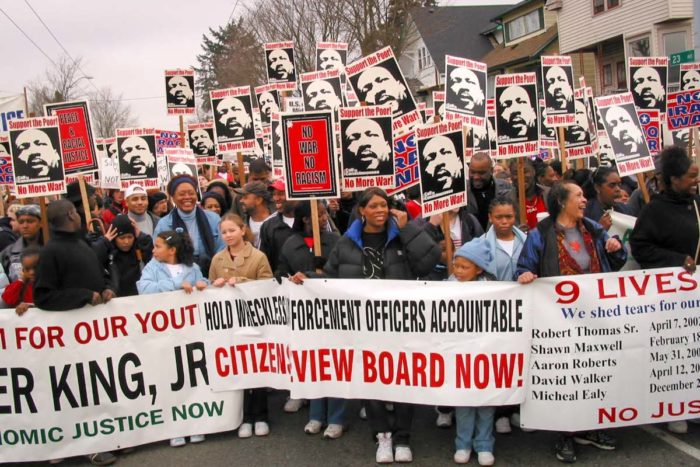 Unwarranted police killings were already an issue back in 2003, with marchers calling for a stronger citizens review board to oversee police. (Photo by Susan Fried)