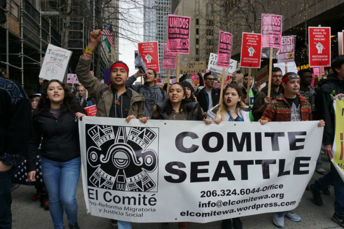Arellano-Martinez, second from left, marched down Jackson Street to Westlake Park alongside immigrants and allies chanting "la gente unida, jamas sera vencida." (Photo by Agatha Pacheco)