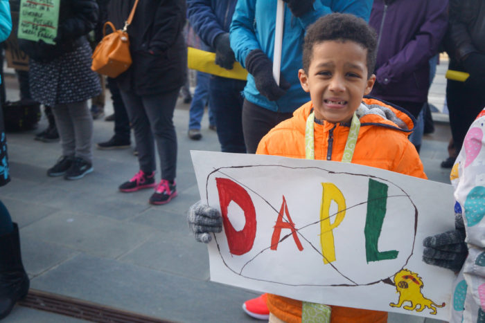 Demonstrators of all ages gathered in the plaza brandishing handmade anti-DAPL signs. (Photo by Aly Brady)