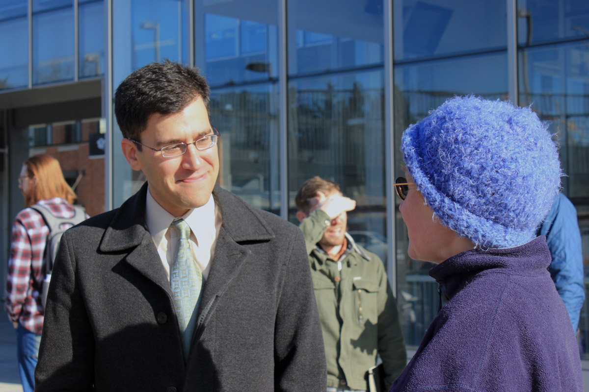 Andres Salomon talks with a supporter outside the UW Light Rail Station Wednesday after announcing that he's running for mayor. (Photo by Katie Anastas)