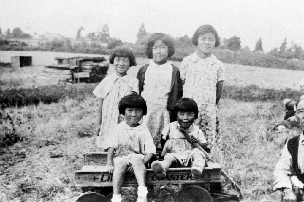The Suguro farm was located in the Midlakes area of Bellevue, Washington. Front (left to right): Sumie and Toshi Suguro. Back: Mae Suguro, Eva Aramaki, and Mitsue Suguro. (Photo courtesy Densho.)