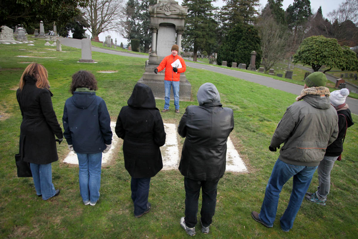 Historian Jared Steed leads a tour of the Lake View Cemetery, where figures from Seattle's early years are buried. (Photo by Alex Stonehill)