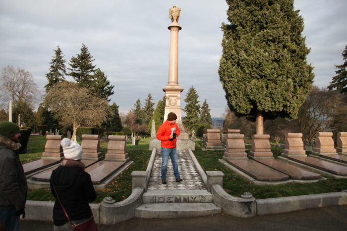 Steed stands on the tomb of the Denny family, the first white settlers in Seattle. (Photo by Alex Stonehill)