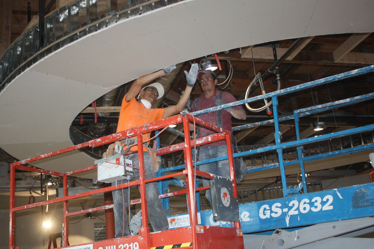 Workers in the museum's rotunda. (Photo by John Stang)